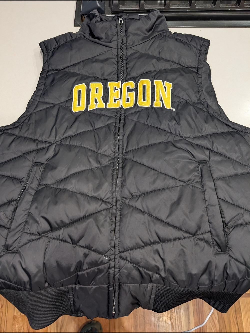 Colosseum brand OSU Puffer Vest in Black with Yellow Lettering
